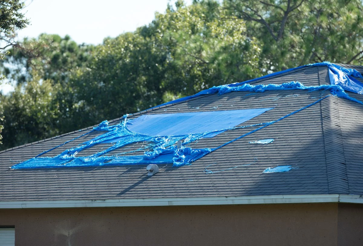 Kingwood roof damaged by a hurricane that requires Kingwood roof replacement